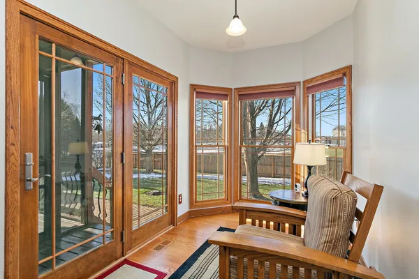 a living room with furniture and a floor to ceiling window