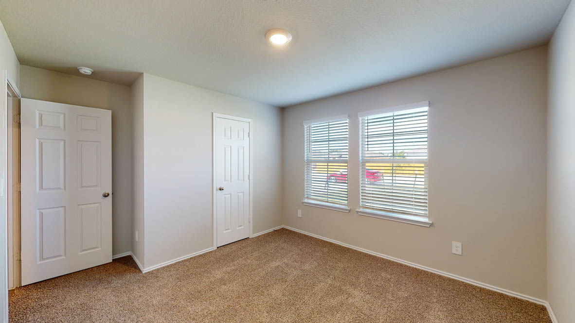 509 Hector Loop Georgetown, TX 78626 - Photo 21 of 31 A well-proportioned bedroom with ample natural light, ready for personalization.