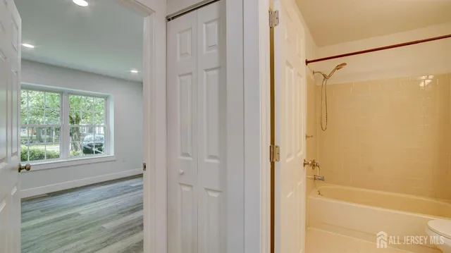 a bathroom with a shower and a tub