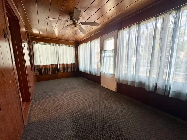 a view of an empty room with a balcony
