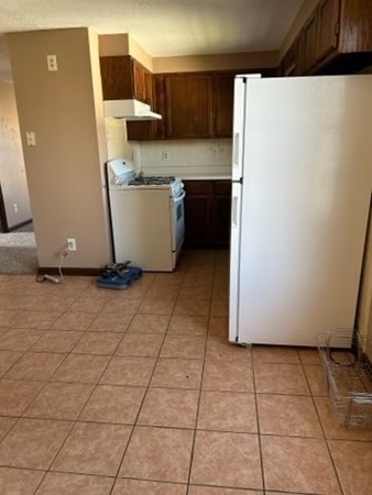 355 Field Street, Unit 2 Fall River, MA 02721 - Photo 3 of 11 a room with a refrigerator and a stove