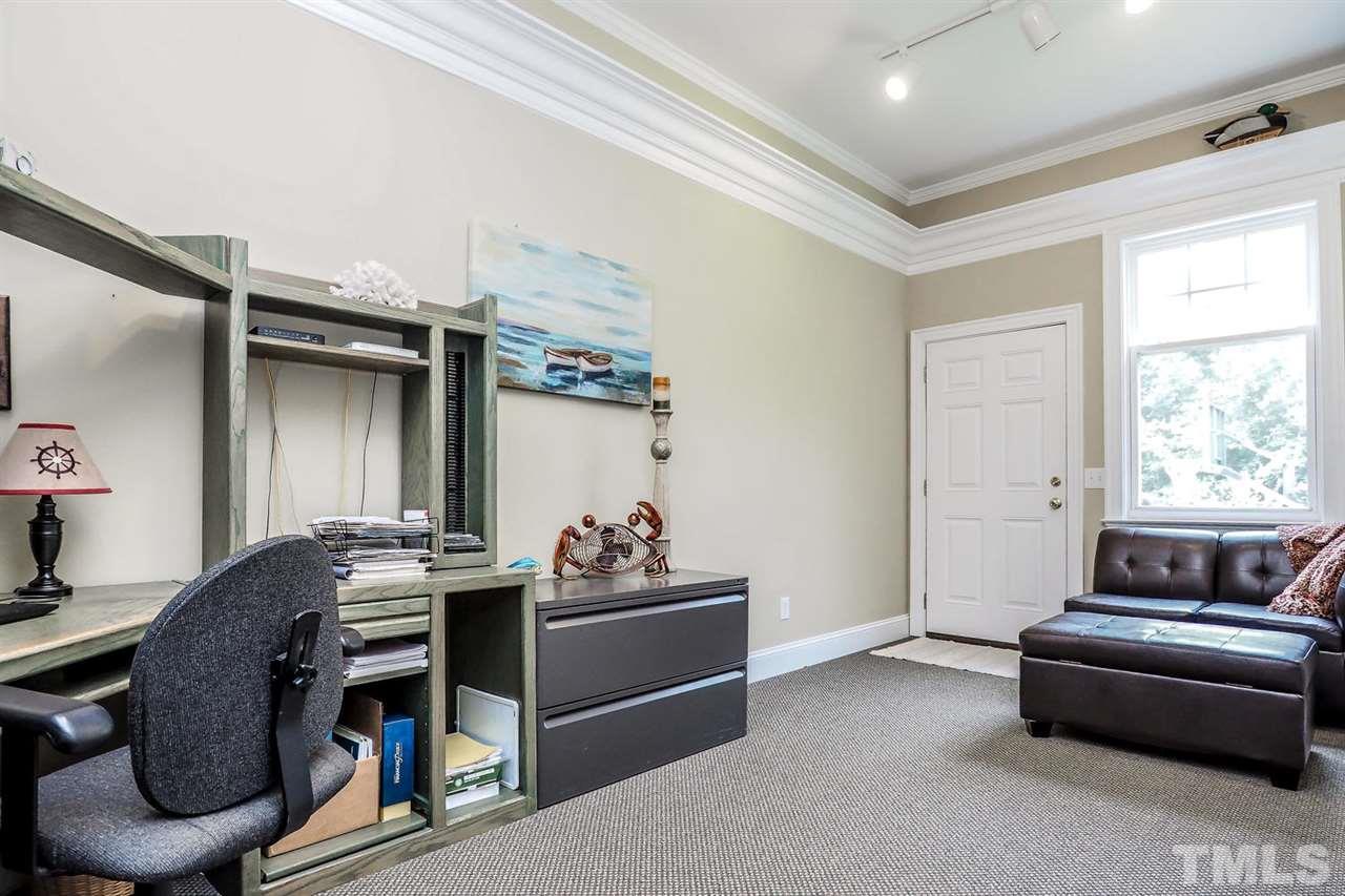 299 Howard Tant Road Zebulon, NC 27597 - Photo 13 of 25 The adjacent Sitting Rm/Office/Nursery has berber carpet, a high shelf around entire room & private exterior entrance.