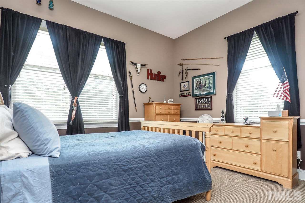 299 Howard Tant Road Zebulon, NC 27597 - Photo 16 of 25 There are 2 more spacious Bedrooms w/lg closets & berber carpet. This is Bedroom 2.