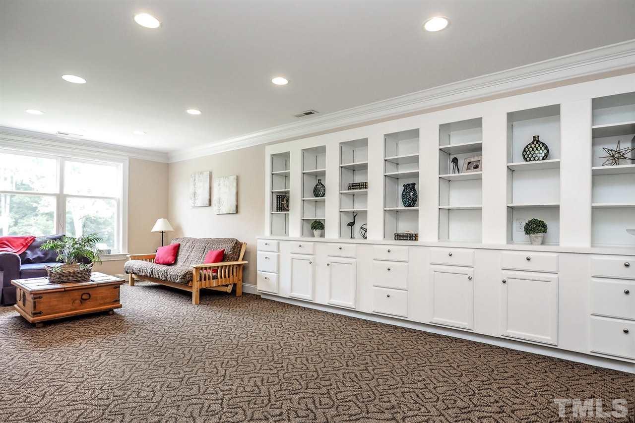 299 Howard Tant Road Zebulon, NC 27597 - Photo 19 of 25 The big 2nd floor Bonus Rm offers berber carpet, recessed lighting & built-in cabinetry/bookshelves.