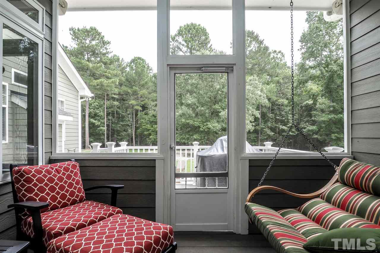 299 Howard Tant Road Zebulon, NC 27597 - Photo 21 of 25 The Screened Porch off the Living Rm has a CF & 10’ ceiling.