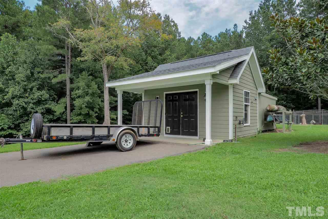 299 Howard Tant Road Zebulon, NC 27597 - Photo 23 of 25 At the end of the driveway is the Storage Bldg w/Shelter.
