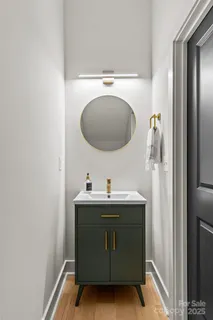 a bathroom with a sink and mirror
