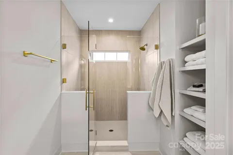 a bathroom with a shower and toilet