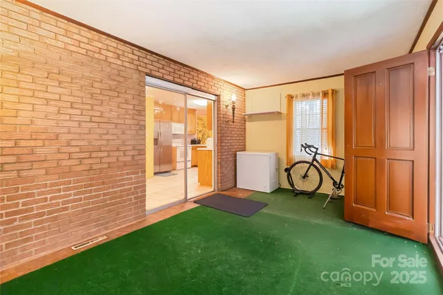 a view of front door with yard