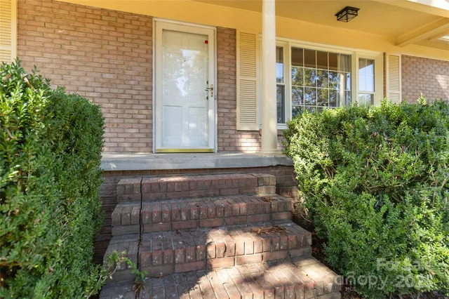 a front view of a house with outdoor space
