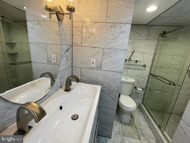 3346 Hewitt Avenue, Unit 11A Silver Spring, MD 20906 - Photo 8 of 16 a bathroom with a sink and a toilet