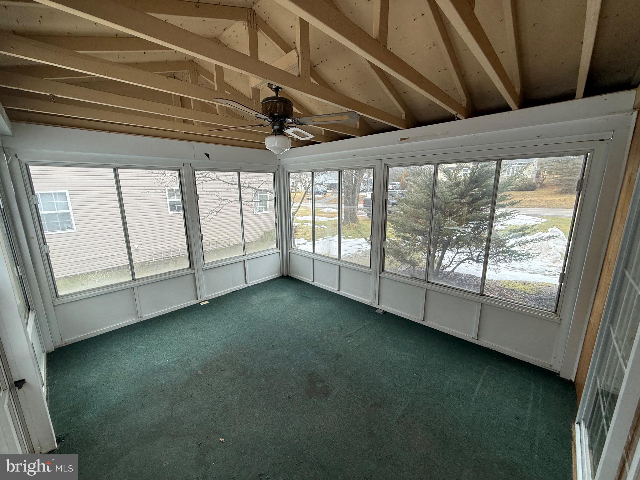 730 East Main Street Weatherly, PA 18255 - Photo 9 of 15 Bright sunroom with scenic outdoor views.