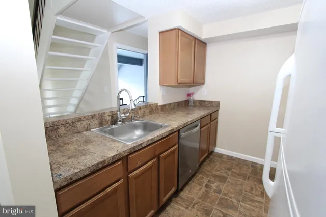 a white refrigerator freezer and a stove top oven