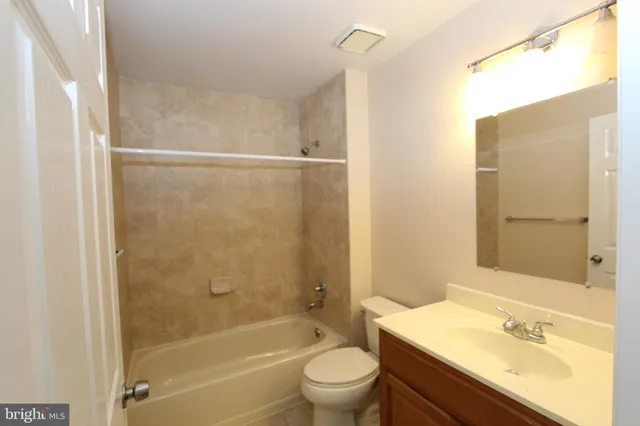 a bathroom with a toilet a sink and a bathtub