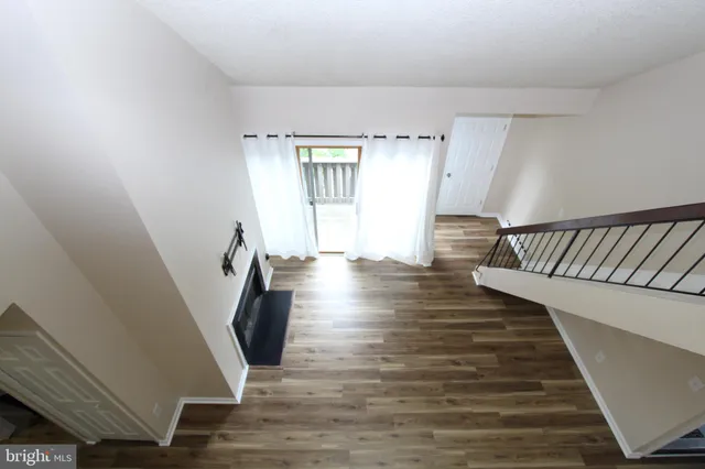 a kitchen with granite countertop a sink and a stove