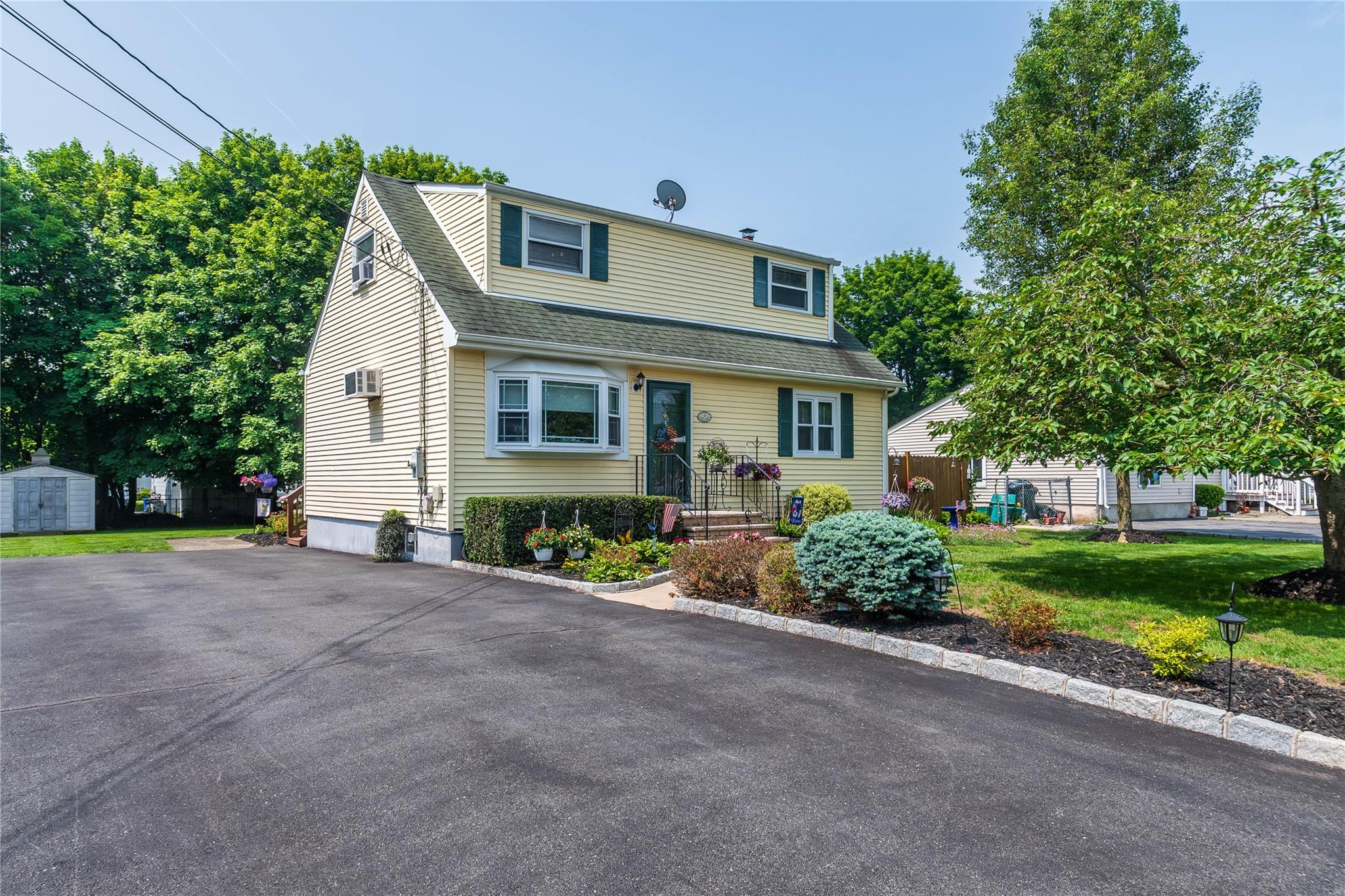 View of front of home with a shingled roof