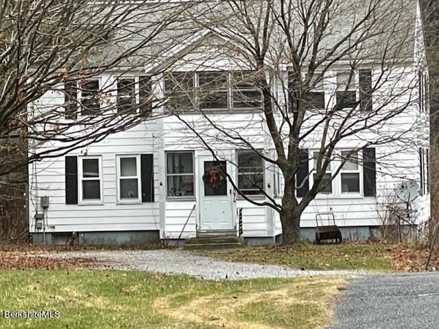 32 North Main Road Otis, MA 01253 - Photo 2 of 30 a front view of a house with a yard