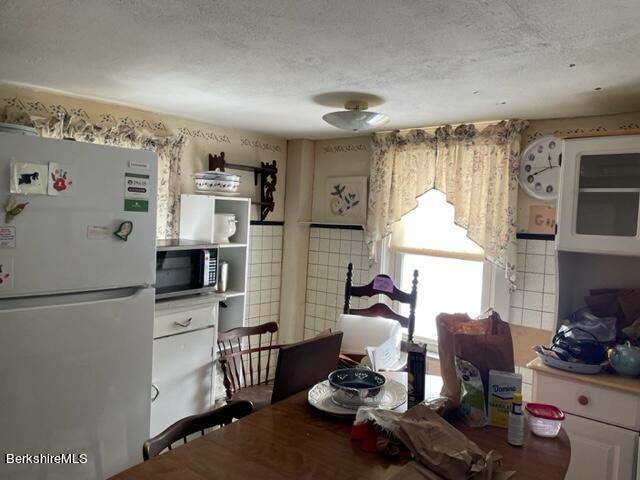 32 North Main Road Otis, MA 01253 - Photo 22 of 30 a kitchen with sink refrigerator and cabinets