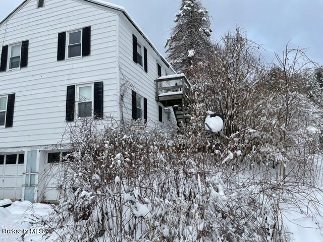 32 North Main Road Otis, MA 01253 - Photo 23 of 30 a front view of a house with garden