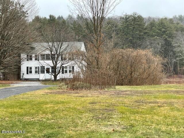 32 North Main Road Otis, MA 01253 - Photo 4 of 30 a view of a swimming pool with a yard