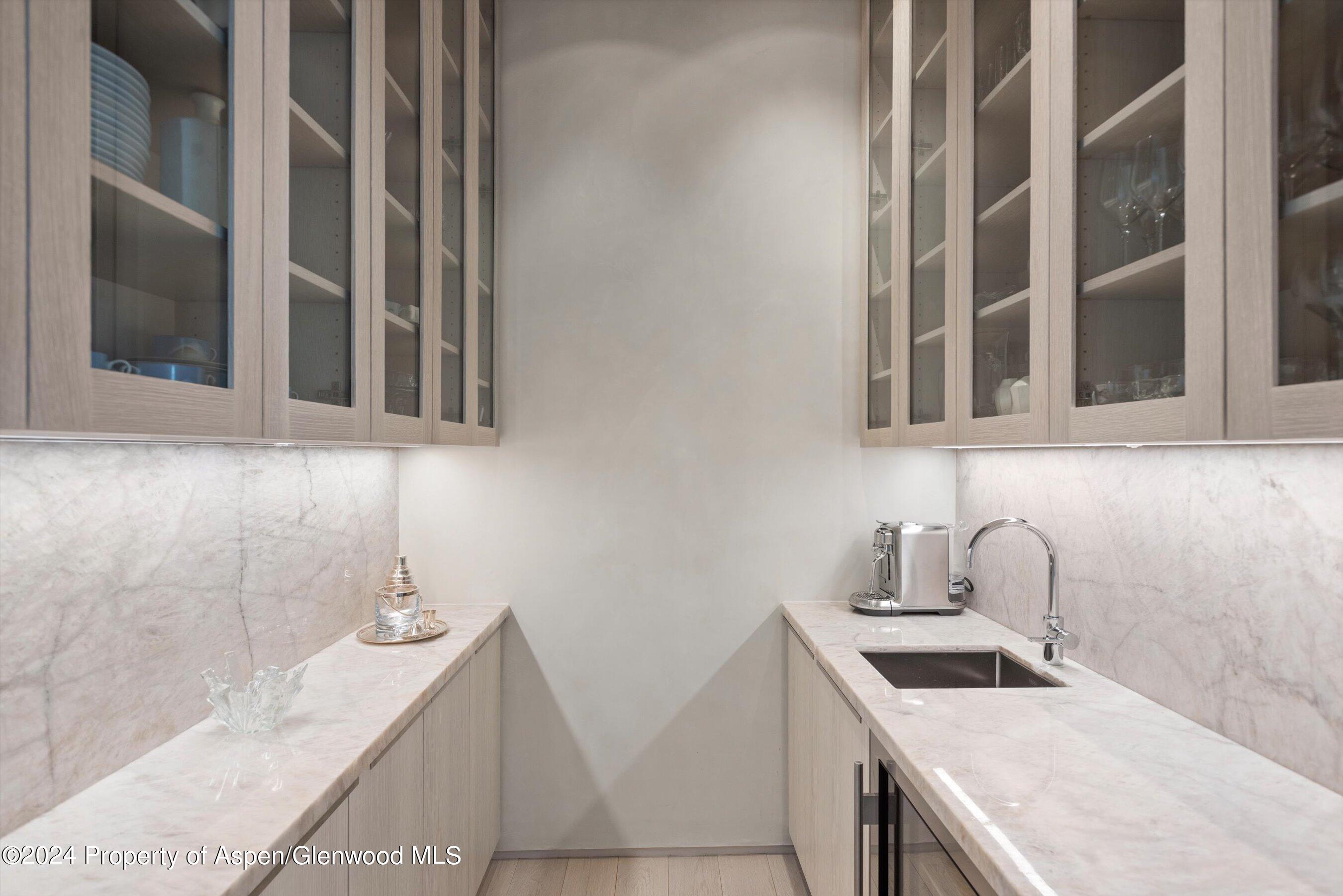 600 Nell Erickson Road Aspen, CO 81612 - Photo 15 of 40 a bathroom with a granite countertop sink and a mirror