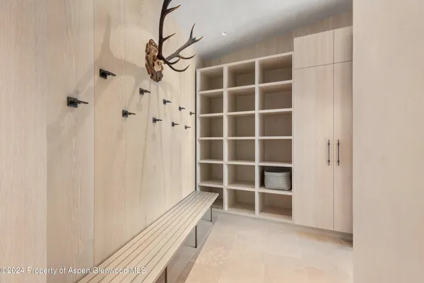 a bedroom with a large window and a bed