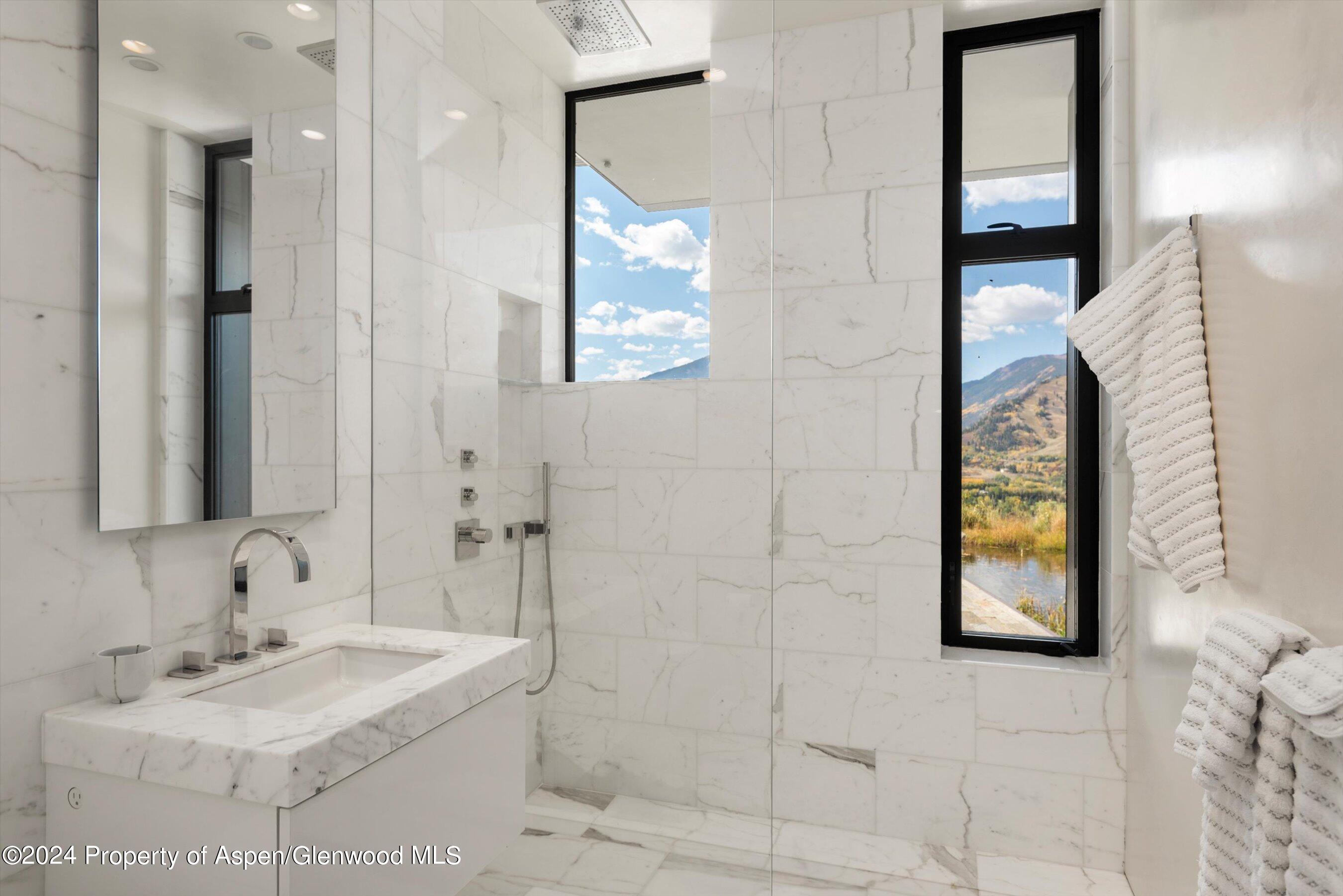 600 Nell Erickson Road Aspen, CO 81612 - Photo 20 of 40 a bathroom with a sink and a mirror