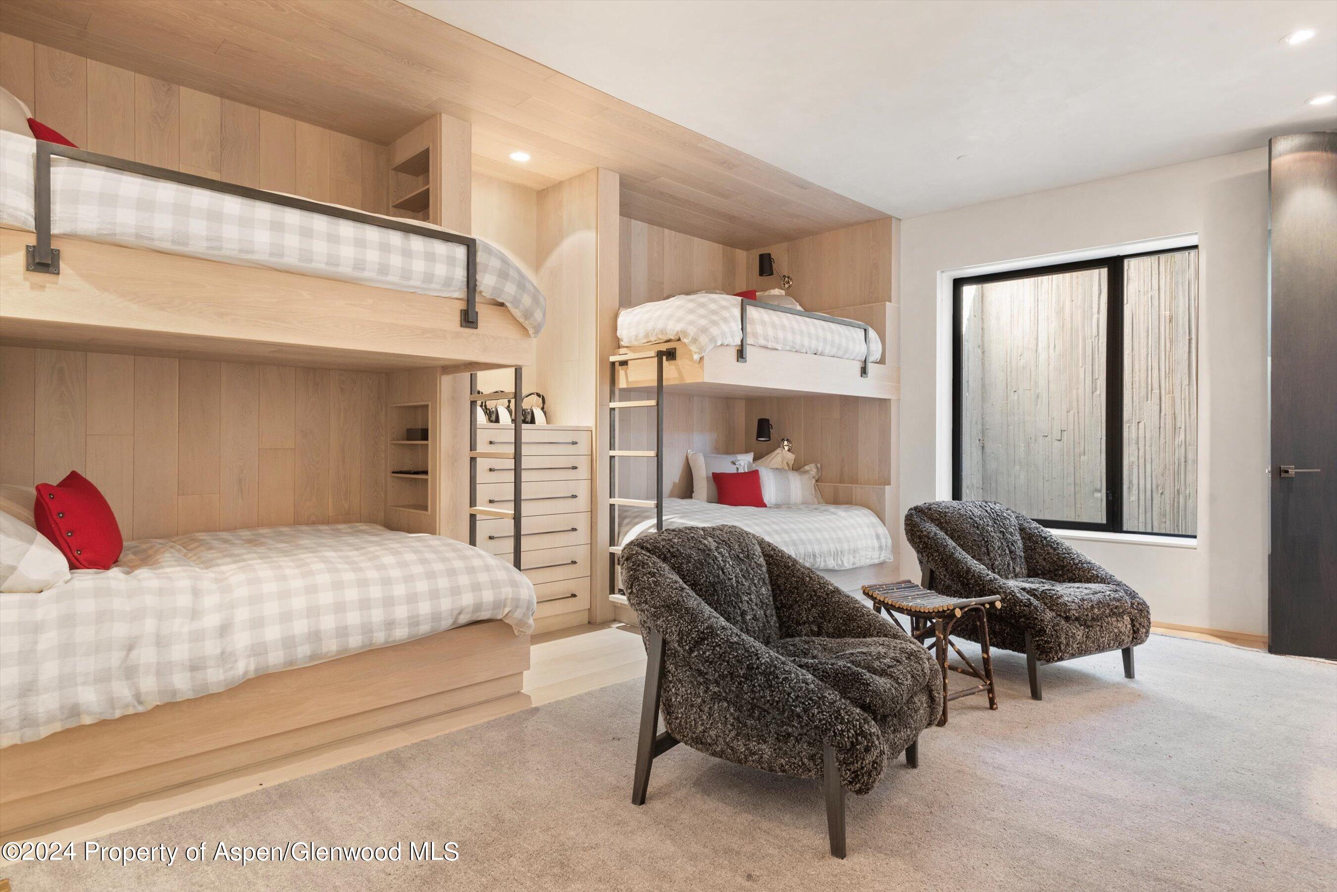 600 Nell Erickson Road Aspen, CO 81612 - Photo 25 of 40 a bed room with a bed and a couch