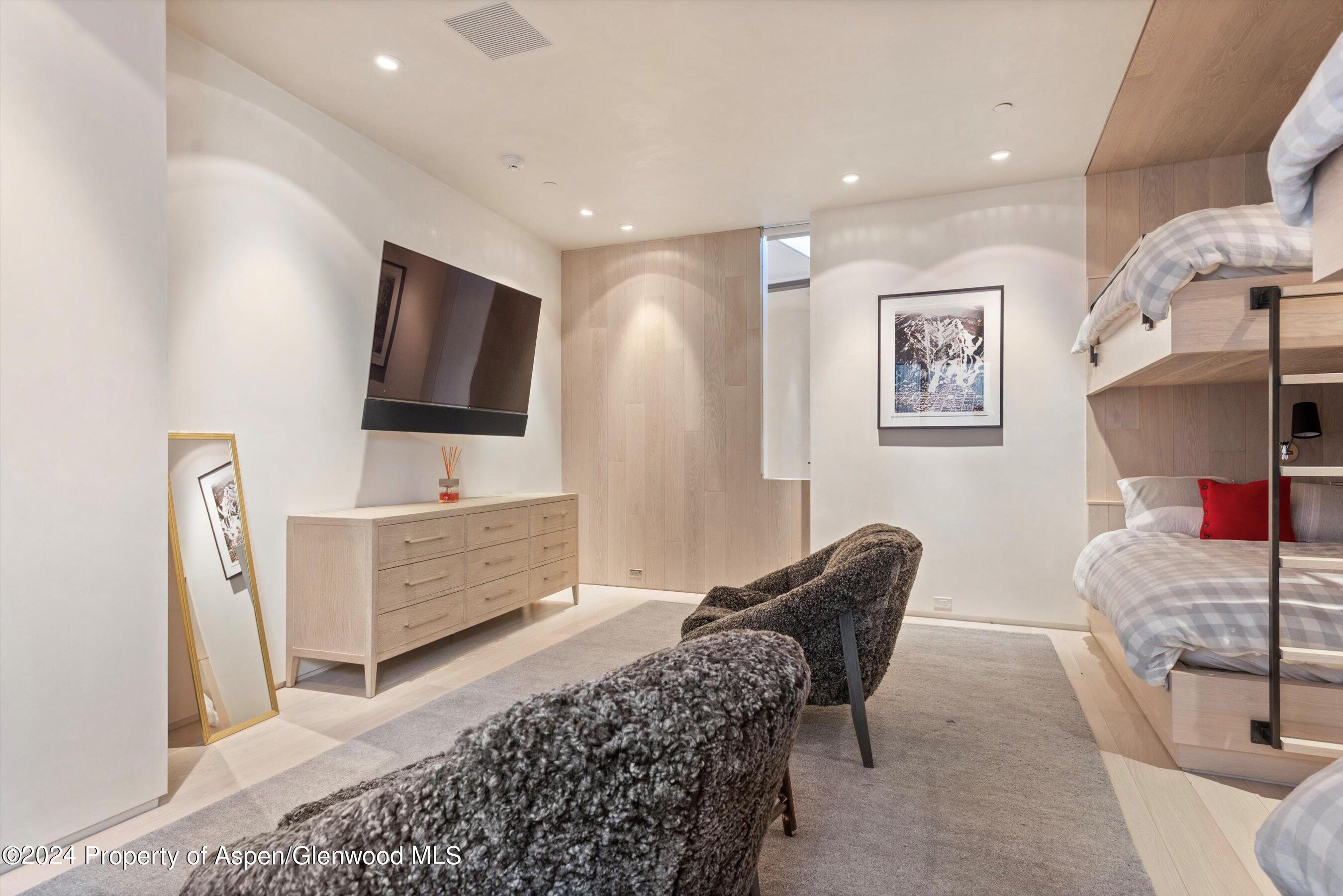 600 Nell Erickson Road Aspen, CO 81612 - Photo 26 of 40 a living room with furniture and a flat screen tv
