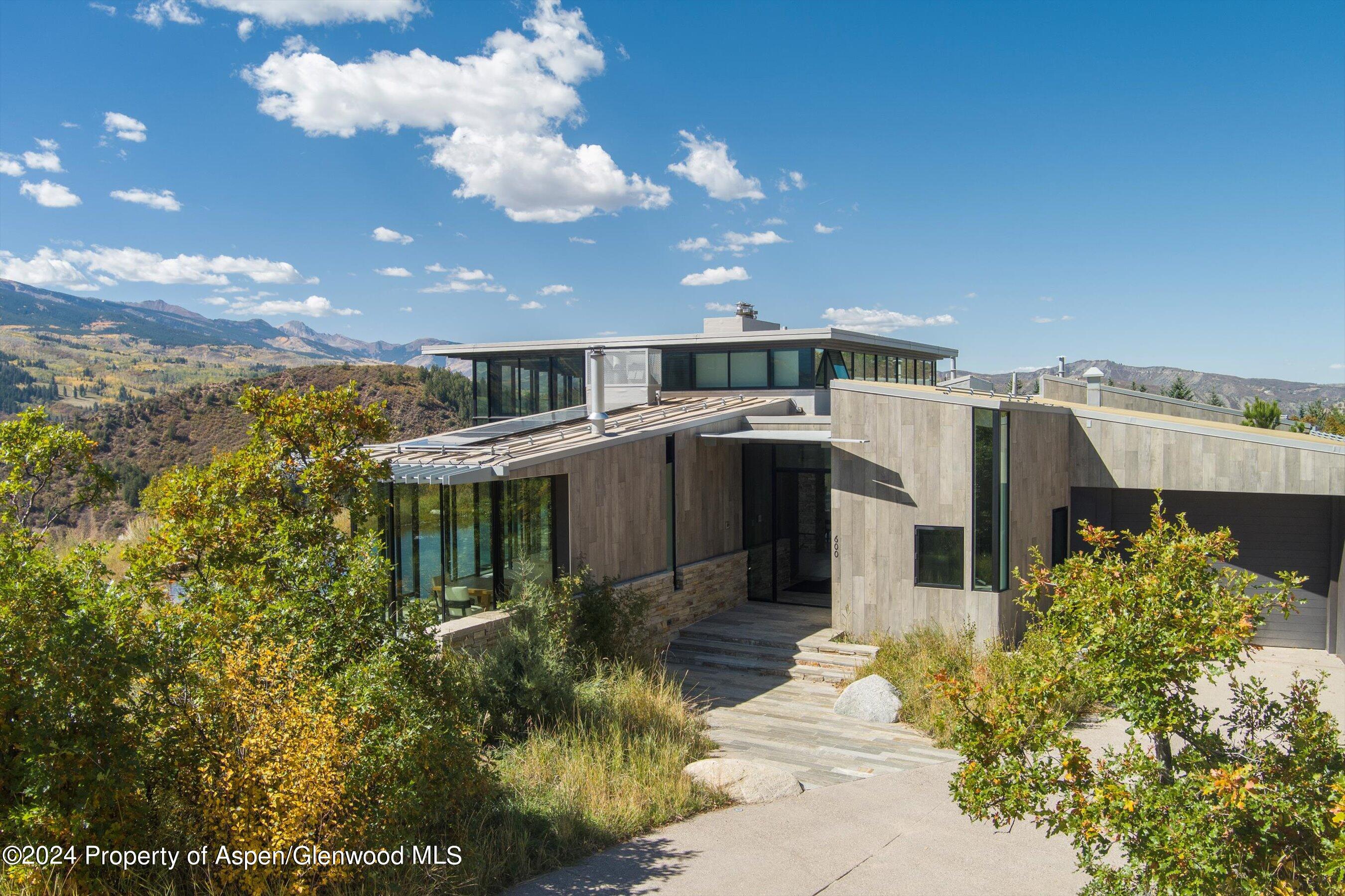 600 Nell Erickson Road Aspen, CO 81612 - Photo 3 of 40 a view of a house with a yard