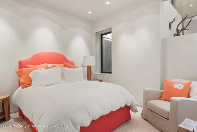 a bathroom with a bathtub a sink a toilet and a mirror