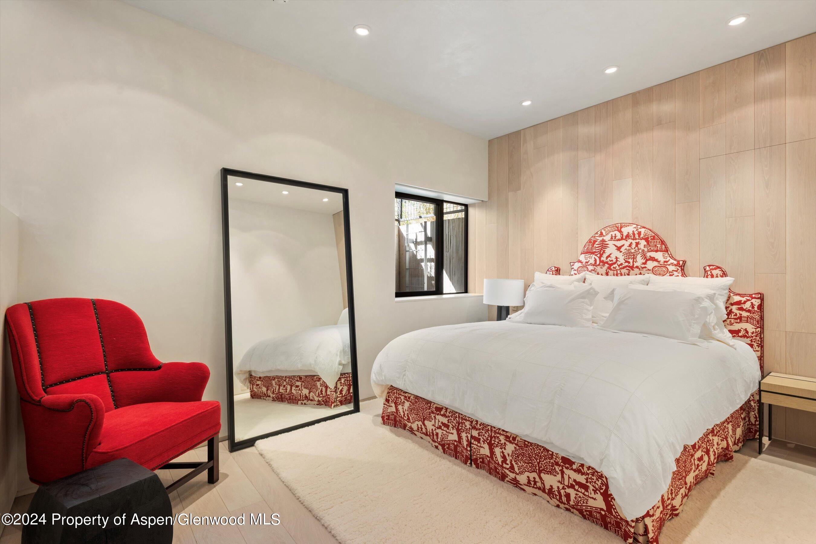 600 Nell Erickson Road Aspen, CO 81612 - Photo 33 of 40 a bedroom with a bed and a couch