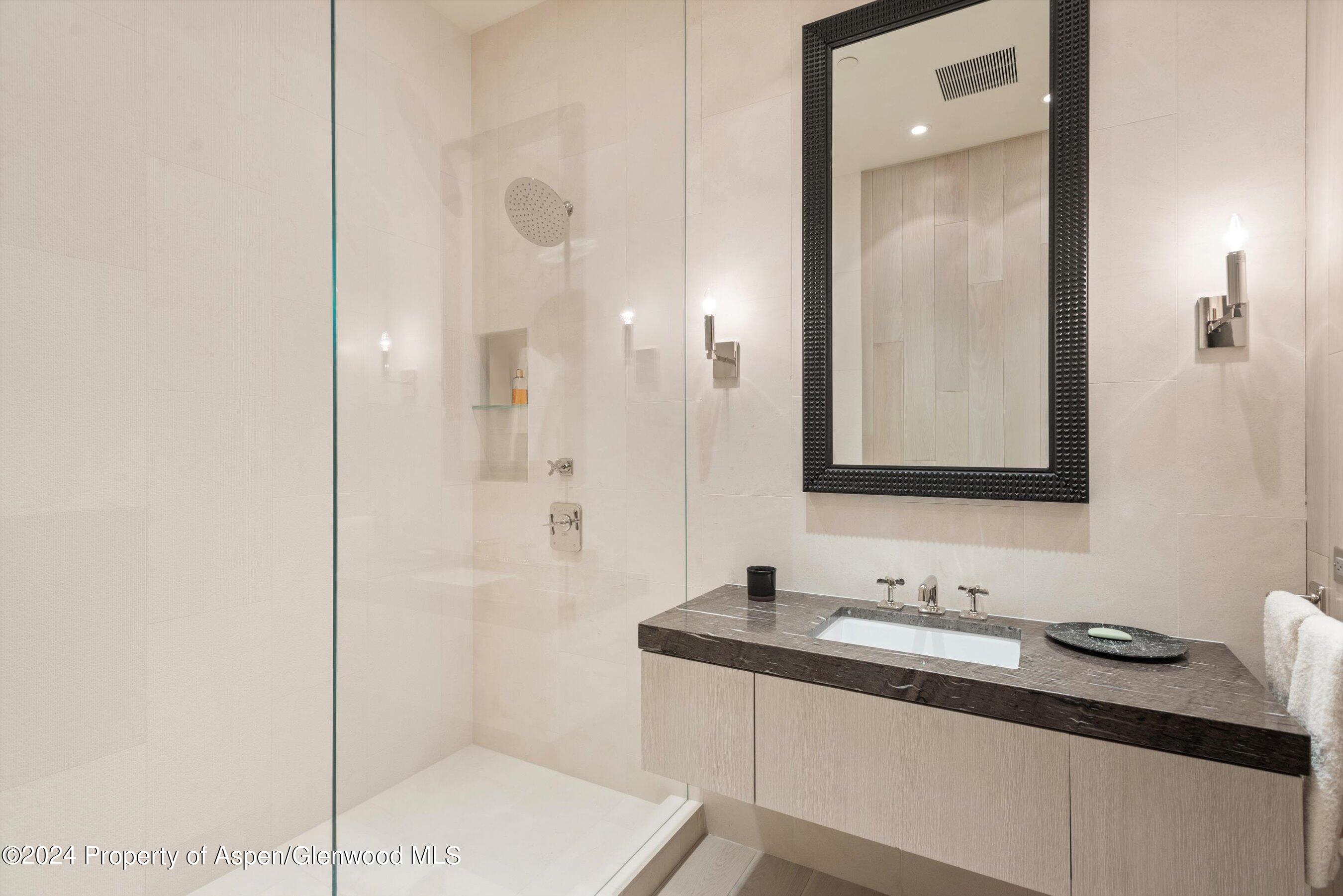 600 Nell Erickson Road Aspen, CO 81612 - Photo 34 of 40 a bathroom with a sink and a mirror