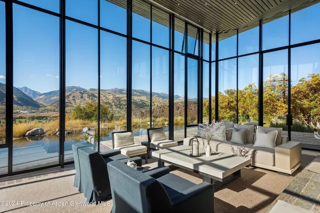a view of a dining room with furniture and window
