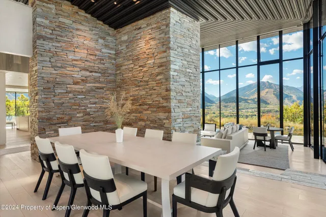 a view of a hallway with seating area