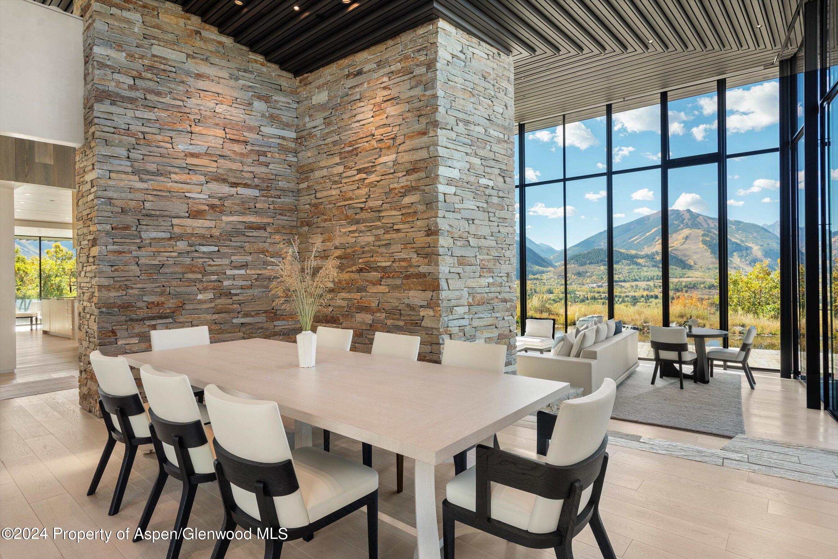 600 Nell Erickson Road Aspen, CO 81612 - Photo 9 of 40 a view of a dining room with furniture and window