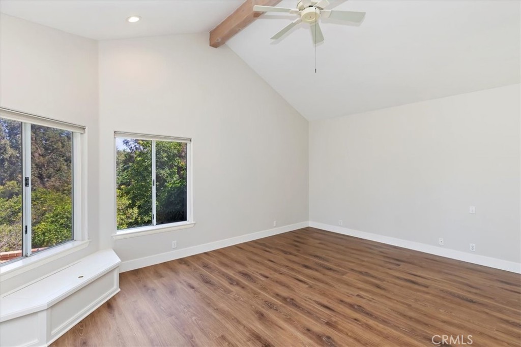 1507 Weston Way Riverside, CA 92506 - Photo 37 of 55 a view of an empty room with wooden floor and a window
