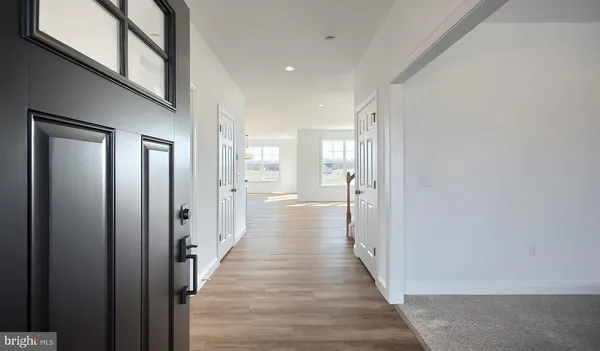a view of a hallway with a wooden floors