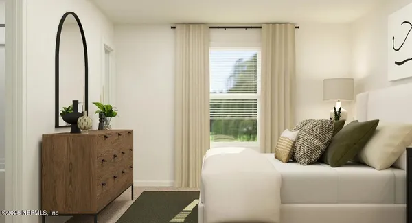 a bedroom with a bed and a dresser