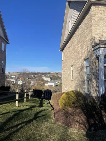 a view of a yard with a terrace