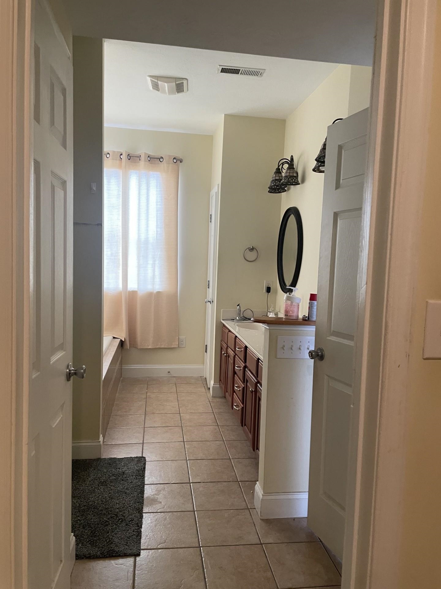 46 Enchanted View Circle Fishersville, VA 22939 - Photo 10 of 16 a bathroom with a sink a mirror and a shower