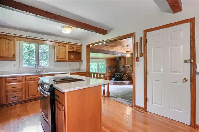 a kitchen with a stove a sink and a refrigerator
