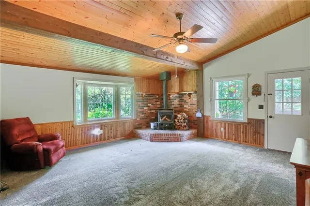 a view of livingroom with furniture and a large window