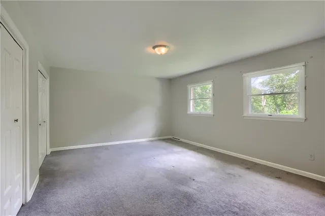 an empty room with windows