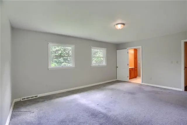 an empty room with windows