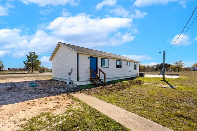 a view of a backyard of the house