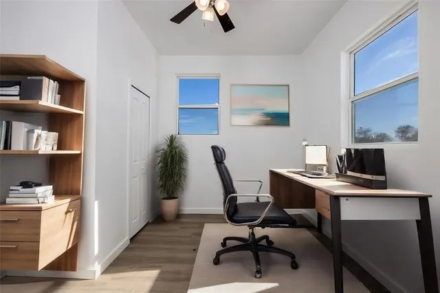 a kitchen with stainless steel appliances a stove microwave and refrigerator