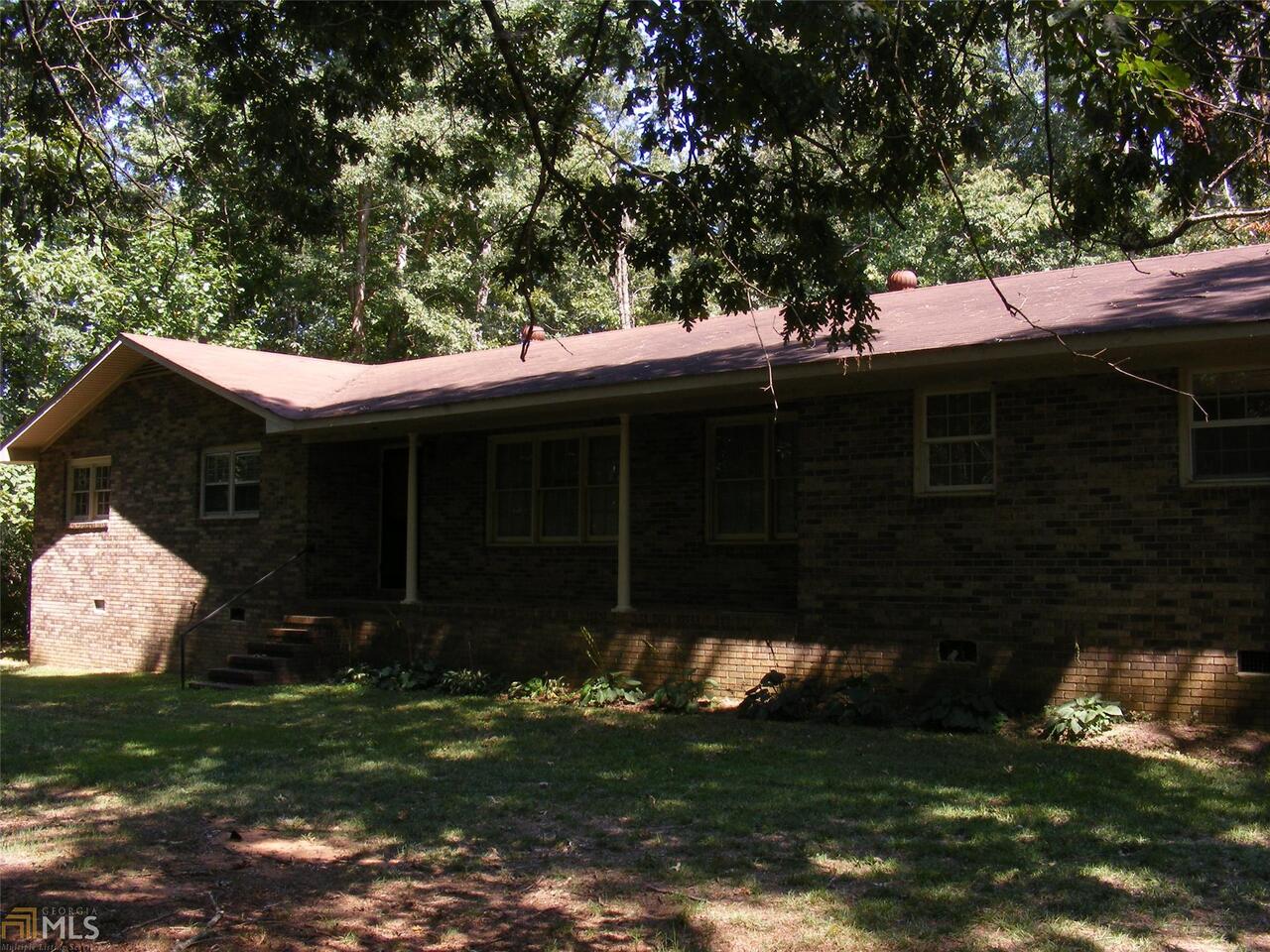 485 Stone Bridge Road Lavonia, GA 30553 - Photo 1 of 1 a backyard of a house with lots of green space