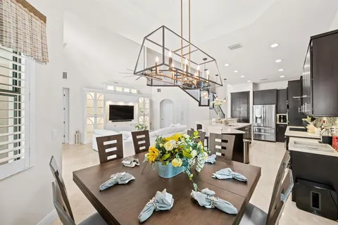 a living room with furniture and flat screen tv