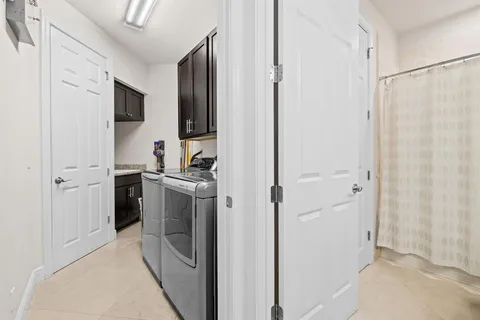 a kitchen with a refrigerator stove and a sink